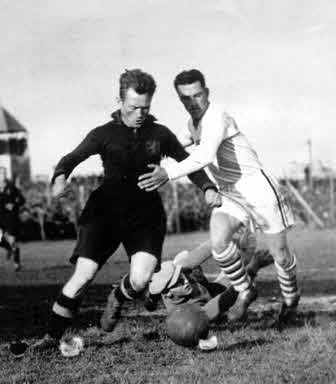 Bertram Patenaude (in white), against Belgium defender Nicholas Hoydonck. Patenaude would score the first hat trick in World Cup history four days later in a 3-0 victory over Paraguay.
