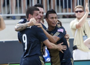 Michael Orozco, Danny Califf and Sebastien Le Toux celebrate a goal vs. Toronto. (Photo: Daniel Gajdamowicz)