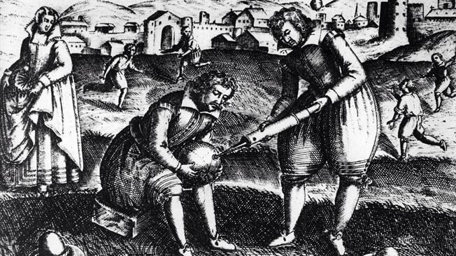 A 17th Century engraving showing the inflating of an animal bladder football.