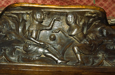 Youths playing football in 14th Century. From a misericord at Gloucester Cathedral.