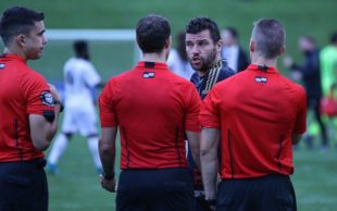 Chambers confronts officials following the full time whistle.