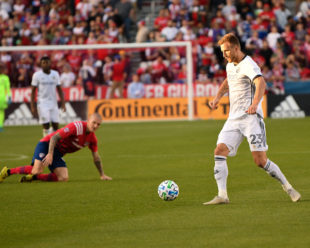 Zdenek Ondrasek, down on the field watches as Kacper Przybylko looks for the next opportunity for Union.