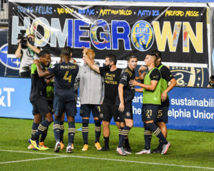 Brenden Aaronson celebrates with his teammates, many Homegrown Players, after his goal taking the Union to a 4-1 lead against DC United.