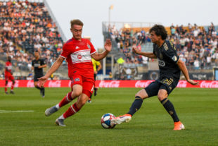 Brenden Aaronson takes on of the Chicago Fire.