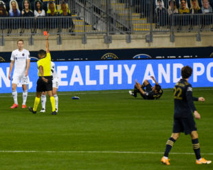 A red card is shown to Chicago Fire's Francisco Calvo in the first half after fouling Alejandro Bedoya.