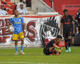 Jose Martinez reacts to a foal against Omir Fernandez.