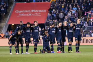 The Union are on the line watching Andre Blake stop Nashville as the rotate turns at the penalty spot. Sergio Santos kneels in prayer.