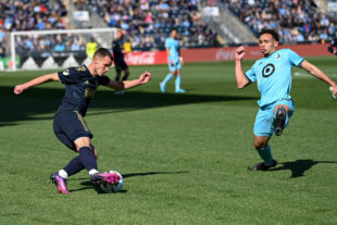 Daniel Gazdag makes a cut, pulling the Minnesota defender the wrong way while he continues to take the ball towards the goal.