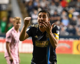 Alejandro Bedoya reacts to a call made by the AR.