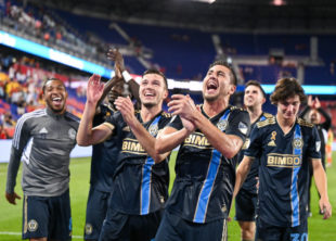 The Boys in Blue salute the fans and enjoy sharing the moment with the Supporters Group on the top level of Red Bull Arena.
