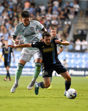 Leon Flach winces in pain from a knee to knee hit with Franco Ibarra.