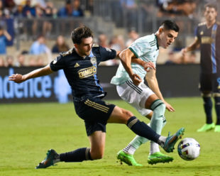 Leon Flach gets his foot on the ball keeping possession for the Union.