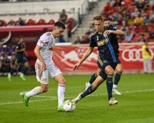 Jack Elliot tracks Lewis Morgan as he looks for a path towards the goal.