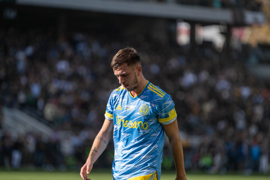 March 15, 2023: LAFC forward Denis Bouanga holds off the challenge