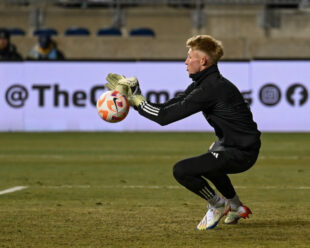 Holden Trent makes a few saves as the Union warm up before the match.