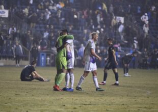 Orlando goal keeper, Mason Stajduhar and Antônio Carlos hug in celebration after defeating the Union.