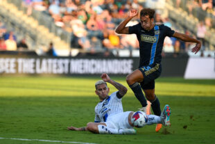 Quinn Sullivan wins the ball in a slide tackle challenge.