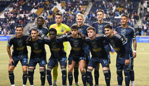 The Union starting 11 stop for a team photo before the start of the game.