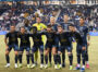 The Union starting 11 stop for a team photo before the start of the game.