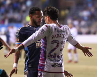 José Martínez confronts Luis Paradela after being hit in the mouth or head butted during the game.