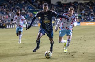Philadelphia Union defender Damion Lowe (17) is challenged by Chicago Fire forward Hugo Cuypers (9).