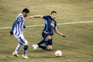 Union midfielder Alejandro Bedoya slides in to intercept a pass intended for Pachuca’s Nelson Deossa (left) in the second half of the Union’s 0-0 draw against Pachuca at Subaru Park in Chester, Pa. on Tuesday night, March 5, 2024.