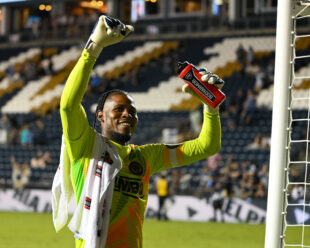 Andre Blake is all smiles as the River End serenades him with the chant "Andre Blake".