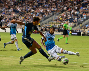 Iuri Tavares tries to block a cross by Quinn Sullivan.