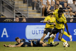 Philadelphia Union midfielder Daniel Gazdag hits the turf after losing the ball to Columbus Crew midfielder Derrick Jones (No. 5) in the first half of the Union’s 1-0 loss to Columbus at Subaru Park in Chester, Pa. on Wednesday night, August 28, 2024. (Kyle Grantham/Philly Soccer Page)