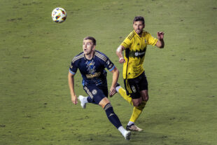 Philadelphia Union striker Mikael Uhre (left) chases down a cross as Columbus Crew defender Yevhen Cheberko (right) gives chase in the second half of the Union’s 1-0 loss to the Columbus Crew at Subaru Park in Chester, Pa. on Wednesday night, August 28, 2024. (Kyle Grantham/Philly Soccer Page)