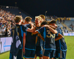 A team celebration in the corner after Mikeal Uhre scored in extra time in the first half.