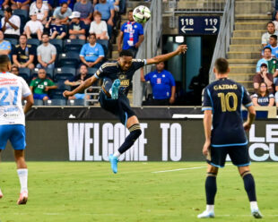 José Martínez clears the ball during the first half of the game.