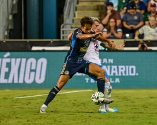 Quinn Sullivan uses his strength to keep the ball.