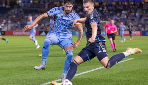 Philadelphia Union's forward 
Mikael Uhre kicks the ball while New York City FC's forward Mounsef Bakrar tries to stop him.