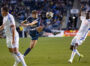 Quinn Sullivan kicks the ball as Obinna Nwobodo attempts to block him.