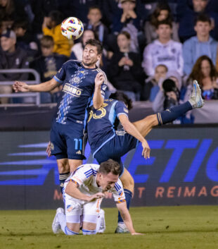 Alejandro Bedoya leaps for a header.