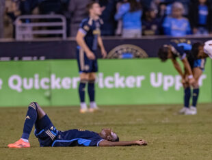 Philadelphia Union’s Danley Jean Jacques lies distraught after a loss against FC Cincinnati 1-2.