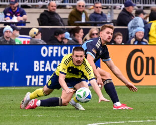 Bruno Damiani gets his foot on the ball before taking Alex Muyl down outside the box.