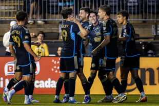 Philadelphia Union Striker Tai Baribo (center right) embraces teammate Indiana Vassilev after scoring in the first half of the Union's 3-2 win over the New York Red Bulls at Subaru Park in Chester, Pa. on Wednesday night, August 13, 2025.